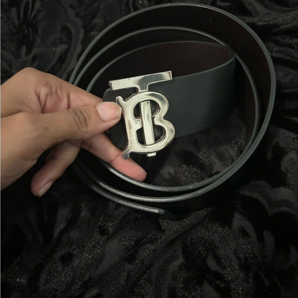 All black Burberry belt with silver Buckle